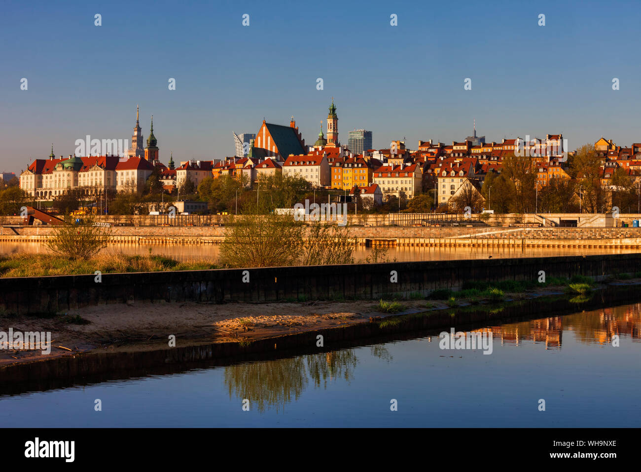 City skyline at sunrise, view across the Vistula River to the Old Town, Warsaw, Poland Stock Photo