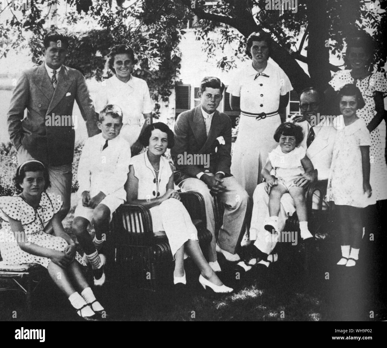 The family of Joseph and Rose Kennedy at Hyannis Port 1934 left to right standing Joe, Jr who was killed in World War II, Kathleen who was killed in plane accident in 1948 JFK (seated) Rosemary; Eunice. left to right seated Patricia, Robert, Rose, Joseph with Edward and Jean Stock Photo