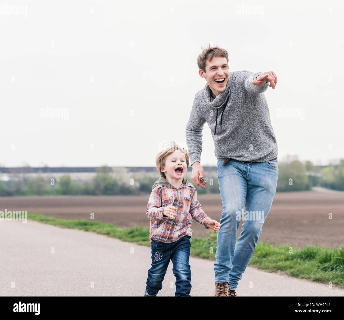 Father and son having fun, outdoors Stock Photo