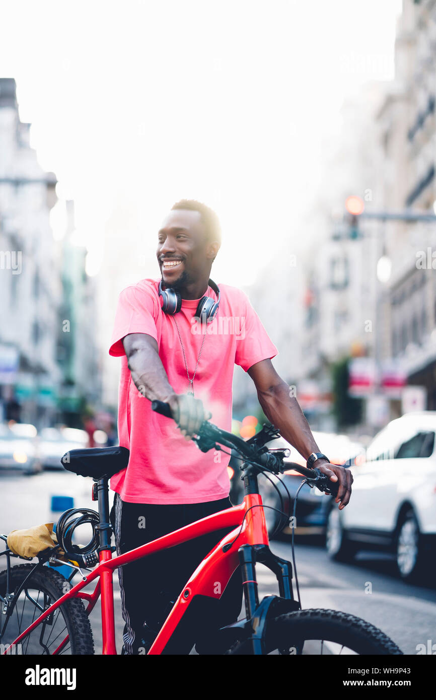 Smiling man black bike hi-res stock photography and images - Alamy