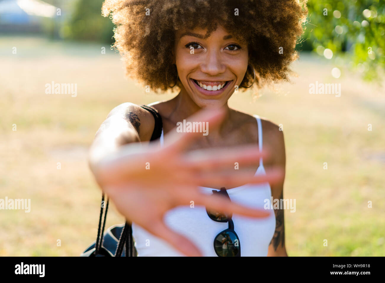 Portrait of tattooed young woman in summer Stock Photo