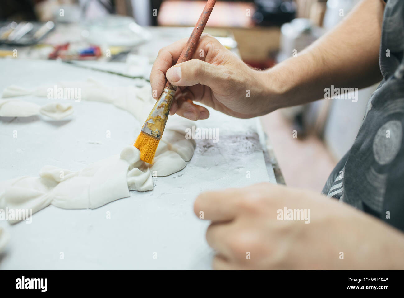 Sculptor working on an object Stock Photo Alamy