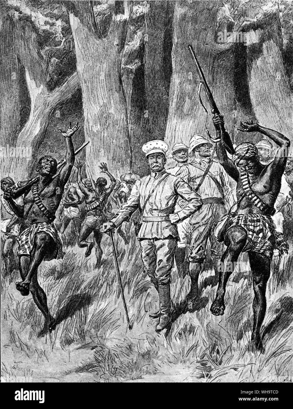 A European expedition emerges from a forest in Africa. 'Daylight at last! The advance column of the Emin Pasha relief expedition emerging from the Great Forest.' Stock Photo