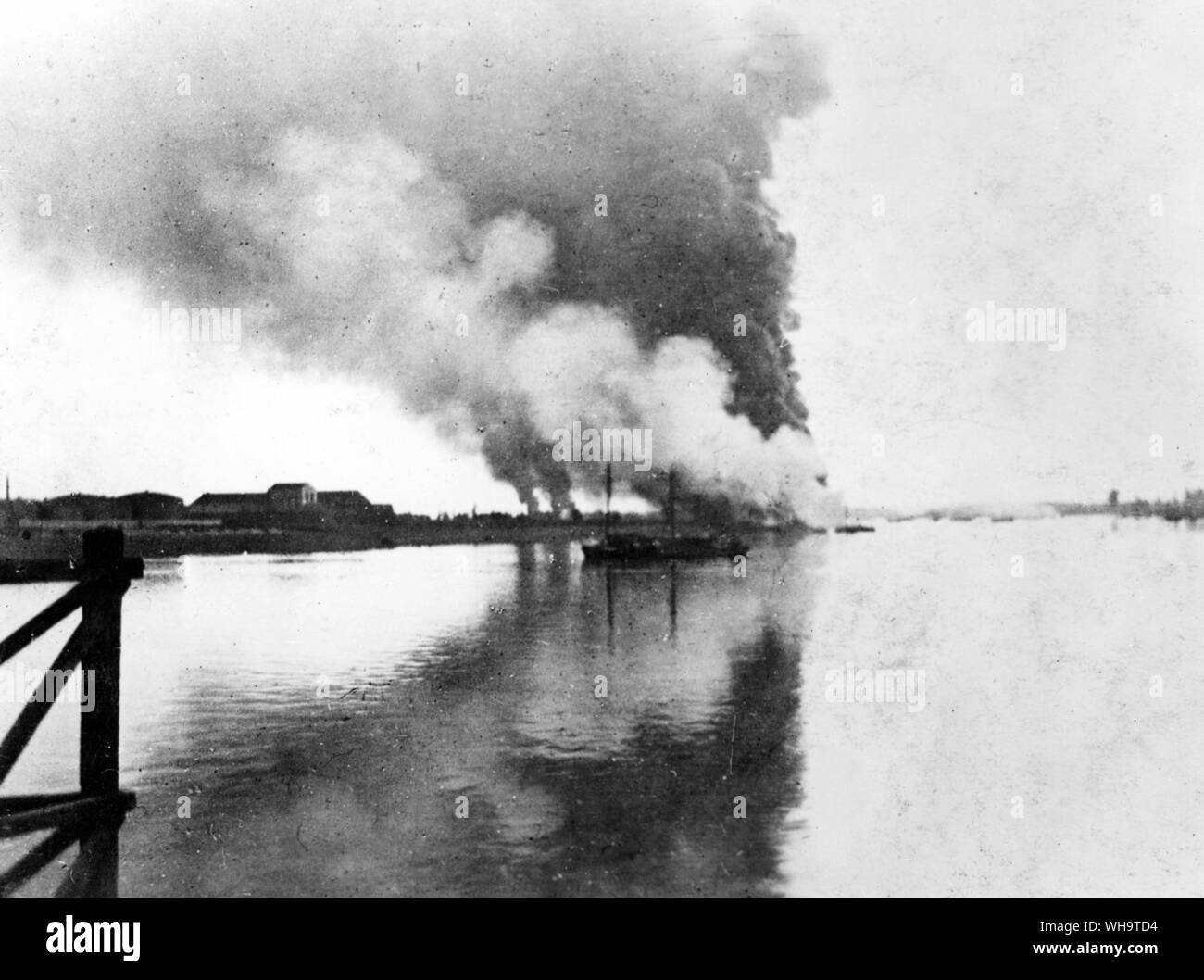 WW1: Petrol tanks burning before the retreat at Antwerp, October 1914. Stock Photo