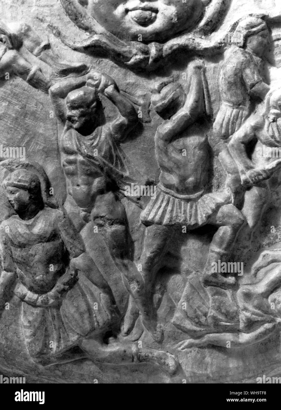 Roman copy of the shield of Phidias' Athena Parthenos. The bald Greek on the left about to strike a fallen Amazon is said to be Phidias himself and the helmetted man beside him whose arm hides his face, Pericles. Stock Photo