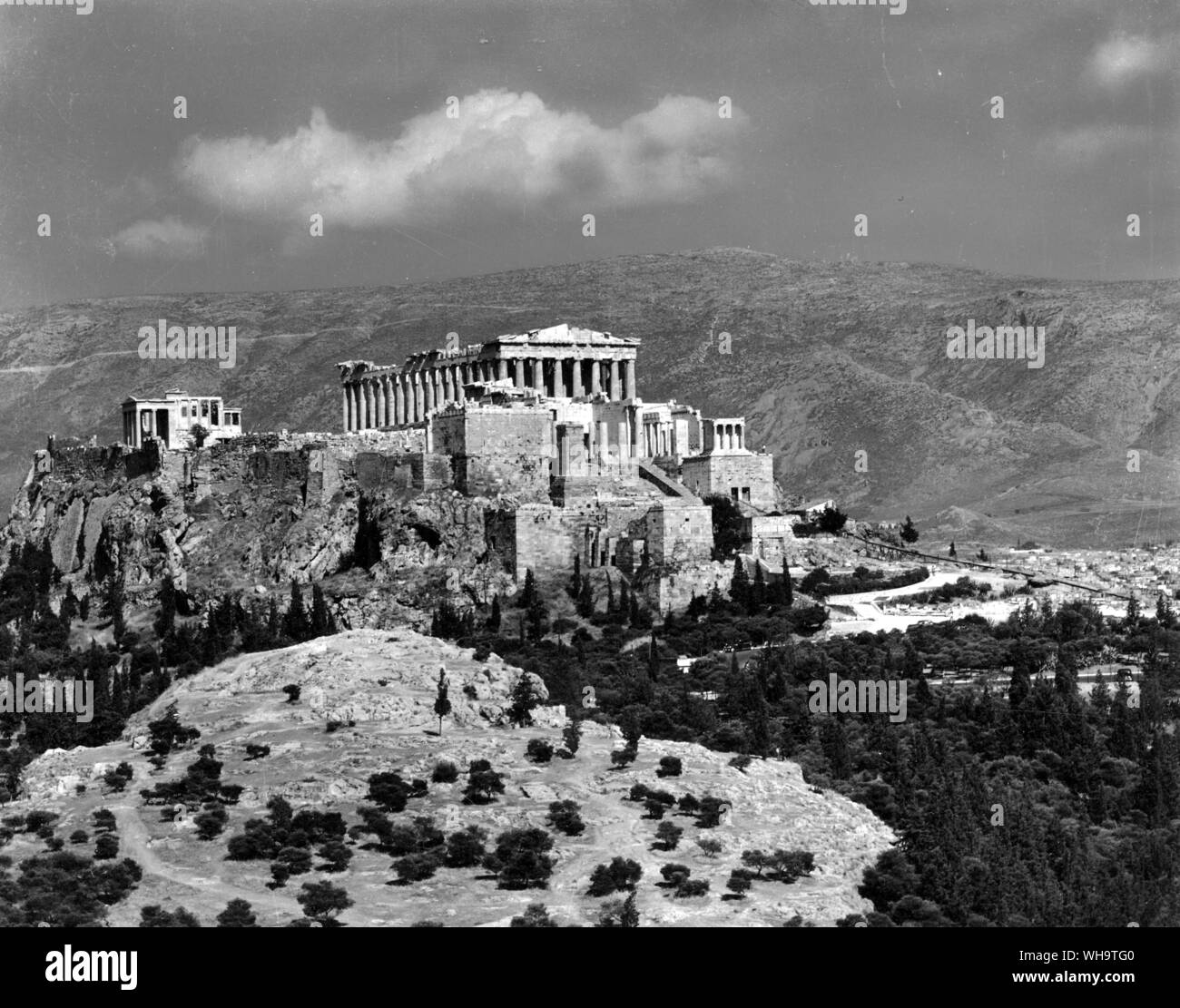 The Acropolis, a great rock to the south of Athens, bears remains of temples and walls from pre-Greek and sixth-century days. Cimon built the great walls early in the fifth century and the main buildings were erected under the direction of Pericles after 450 BC Stock Photo