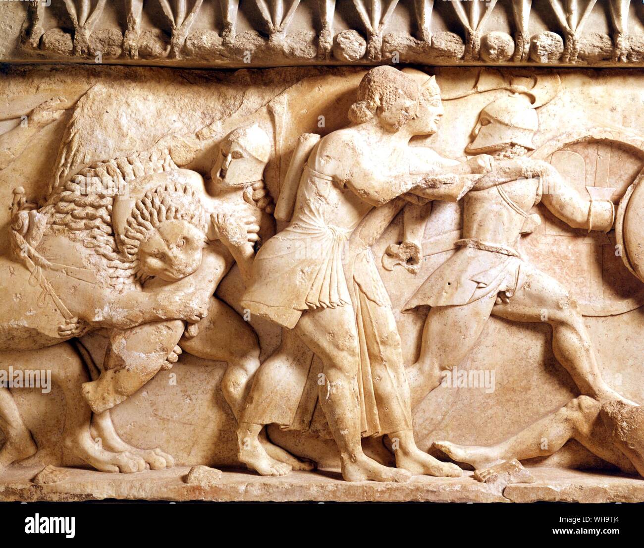 The gods are fighting the giants, awesomely anonymous in their helmets. Apollo and Artemis shoot arrows and the defet of the giants has begun - though armed and unhurt, one on the right is fleeing Stock Photo