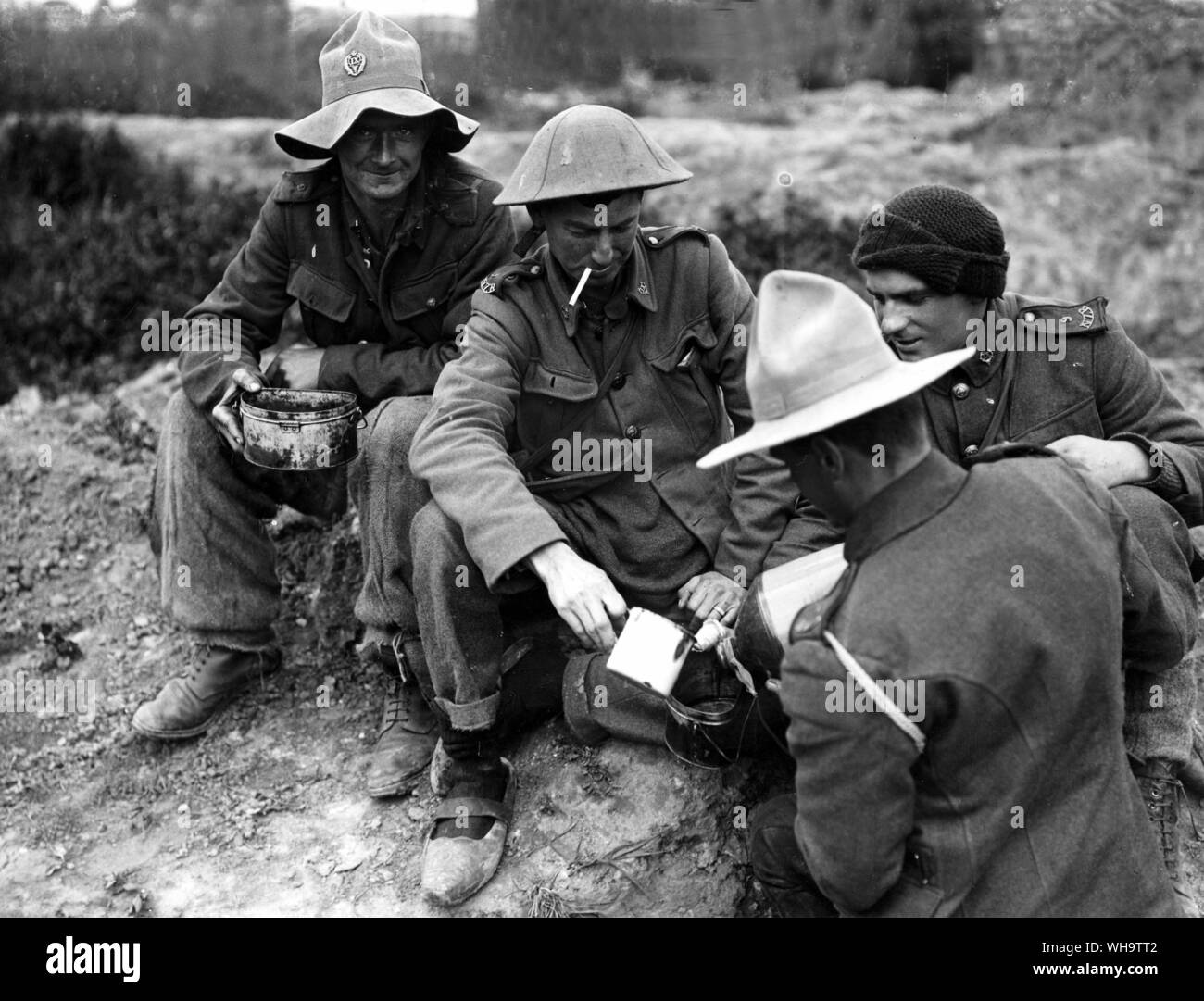 WW1/France: Troops issued with rum ration, June 1916.. . Note the footwear. Stock Photo