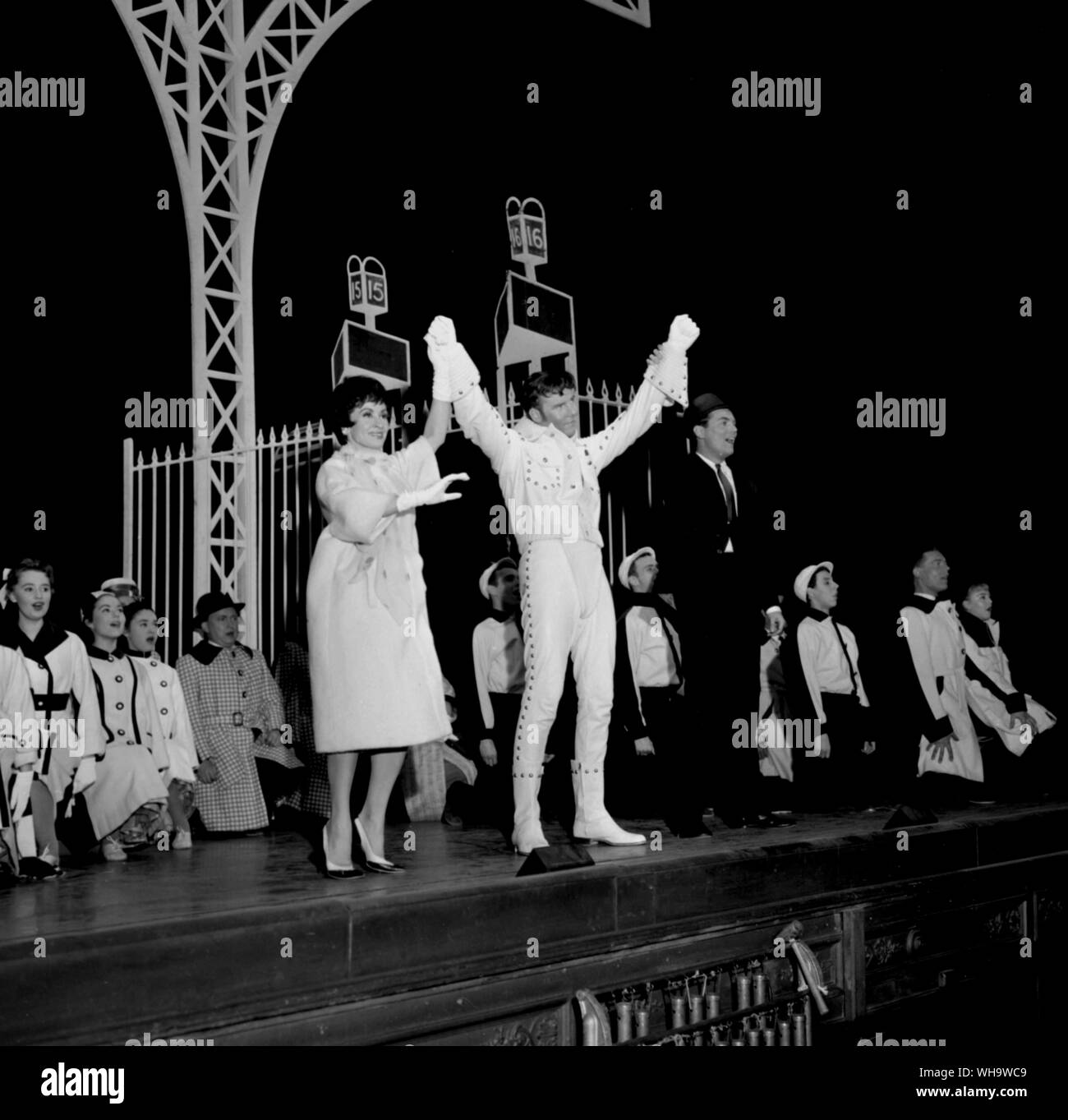 15th June 1961: Marty Wilde (centre stage in white) stars in the musical, Bye, Bye Birdie at London's Haymarket Theatre. To his left is Chita Rivera and to his right, Peter Marshall. Wilde plays a rock 'n' roll star in the show. Stock Photo