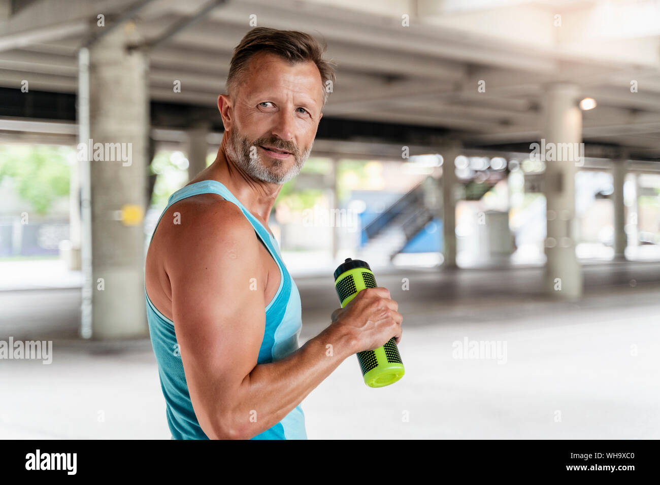 Sporty man with drinking bottle Stock Photo