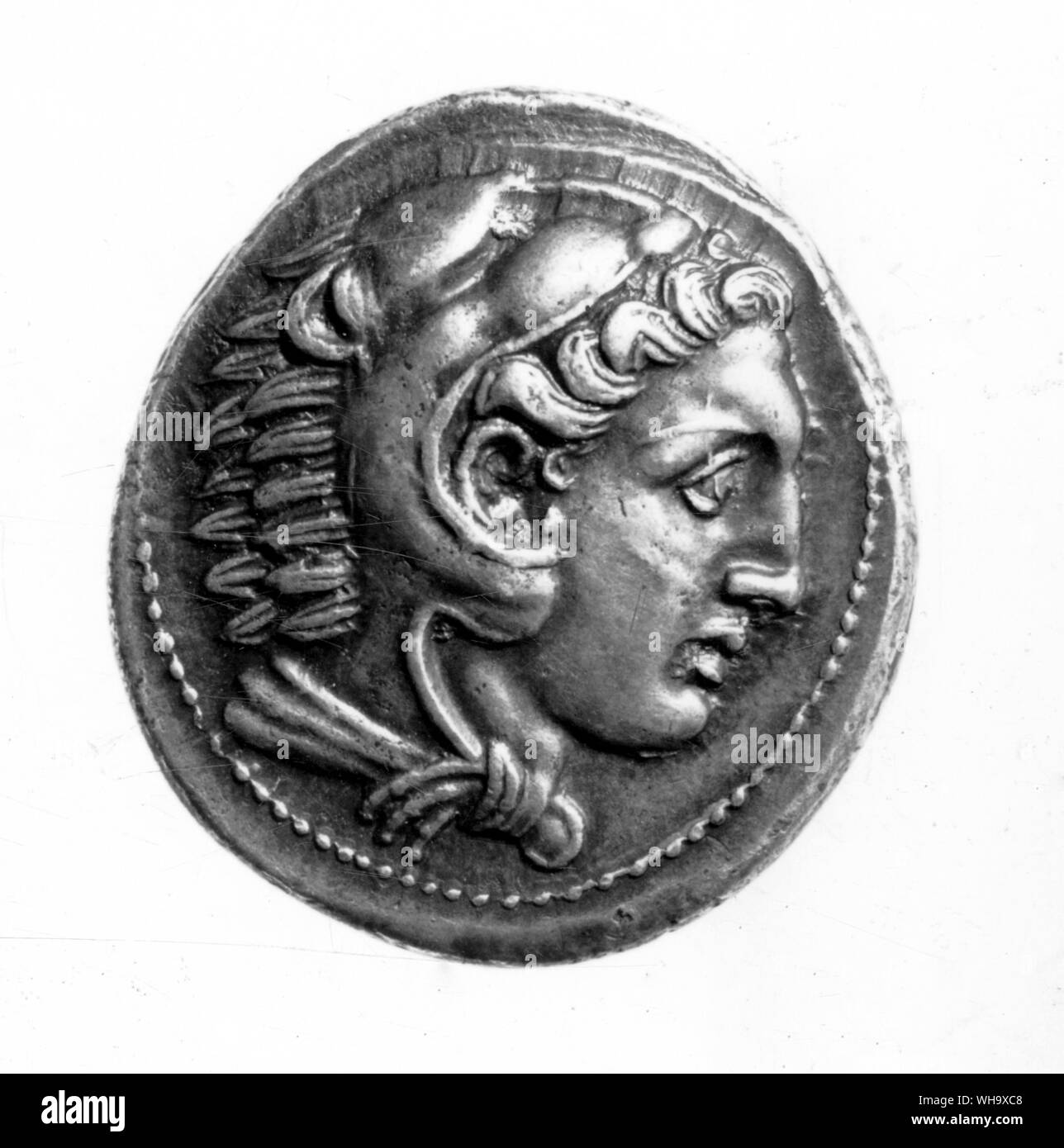 Coins from Alexander's foreign mints.  Heracles with lion - mask hood. Stock Photo