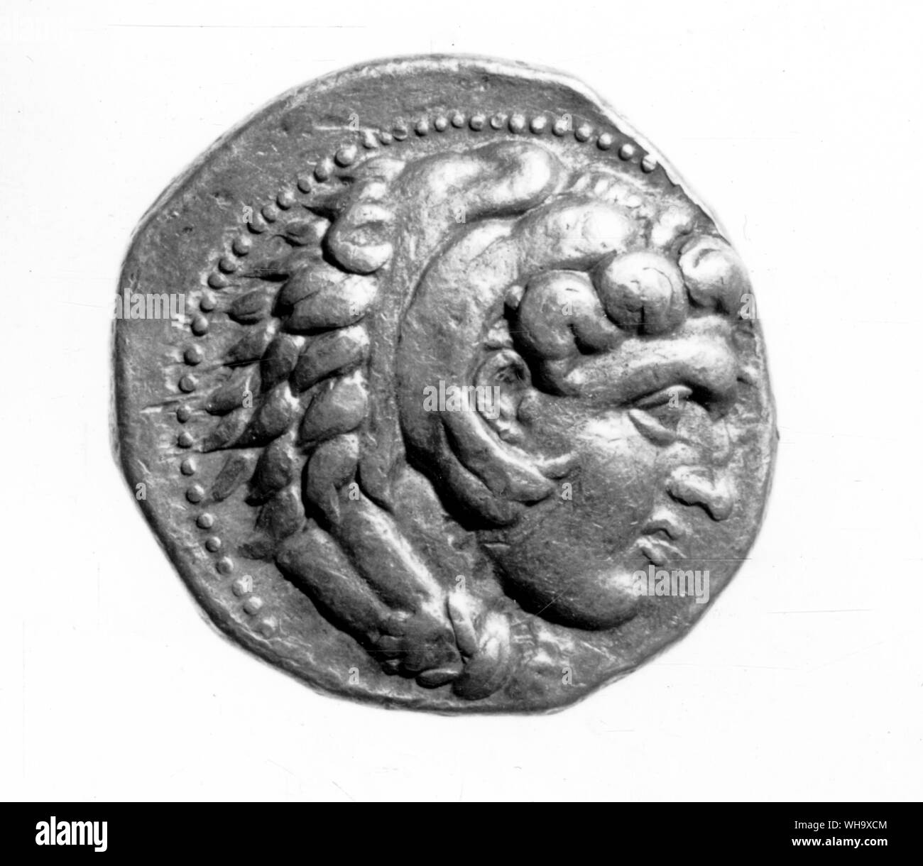 Greek coin - possibly the head of Alexander Stock Photo