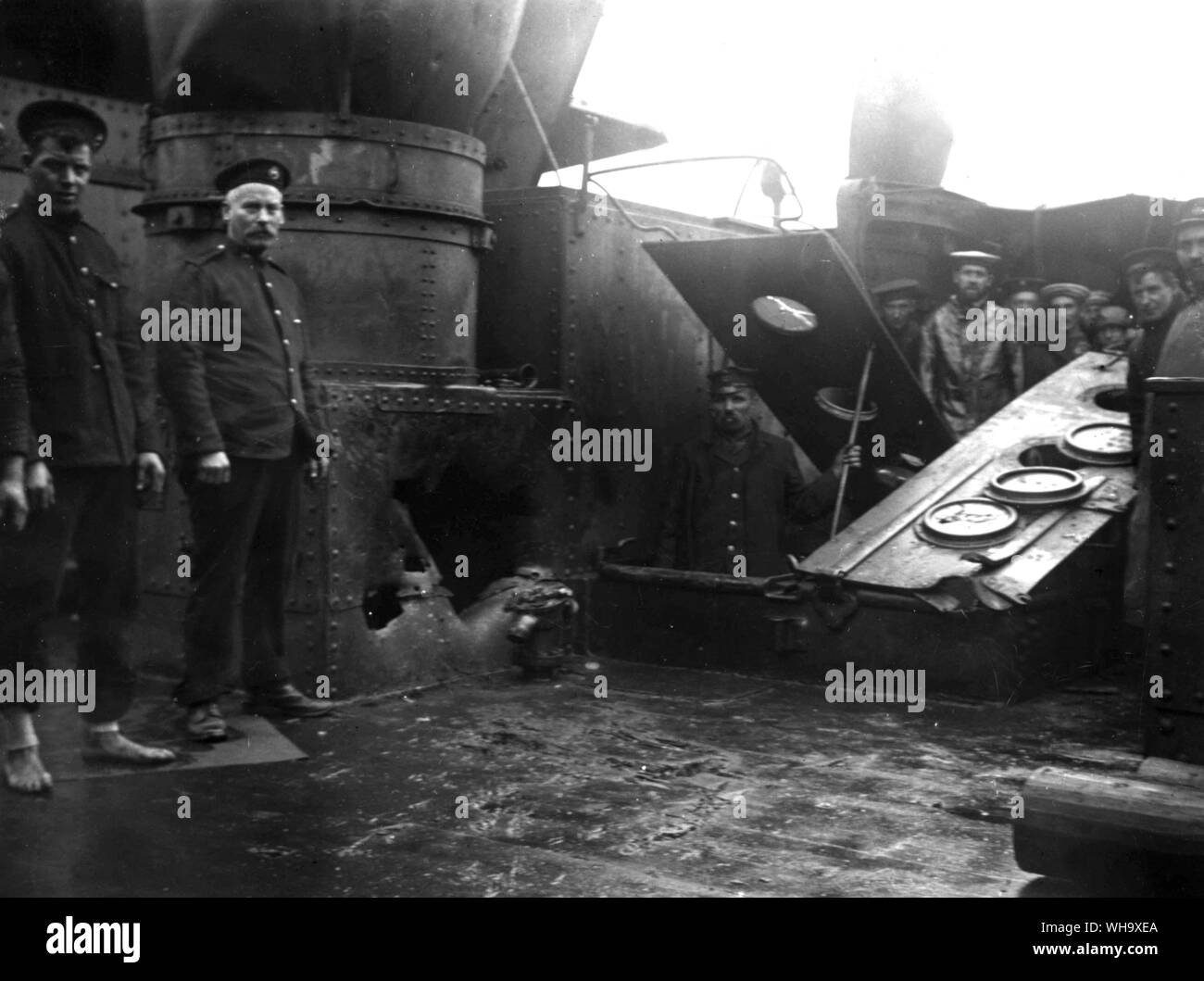 WW1: Damage to HMS Kent at the Battle of the Falkland Islands. Sailors inspect the damage. Stock Photo