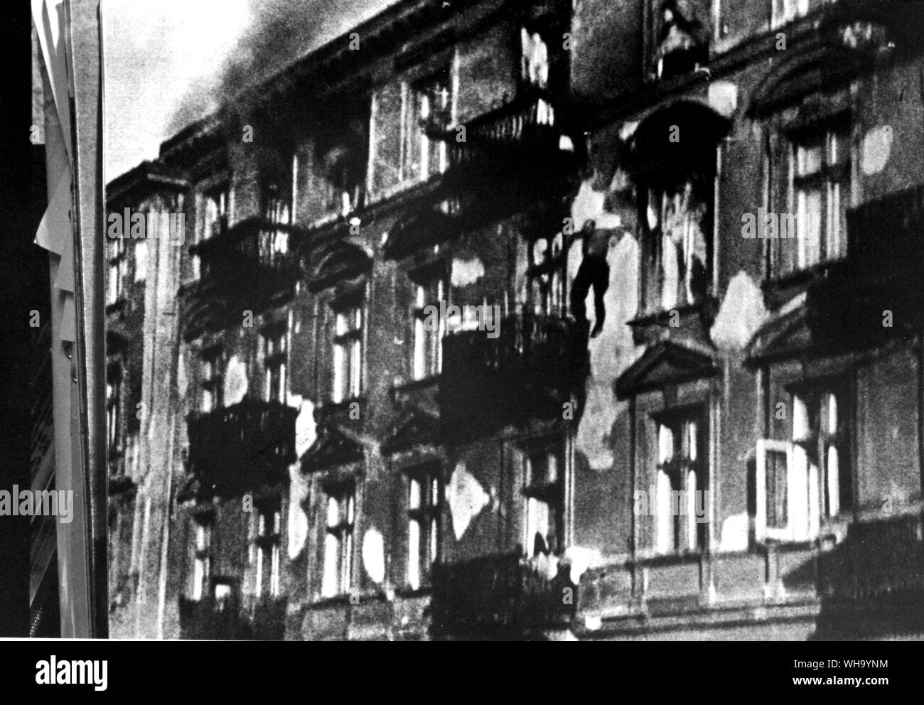 WW2: People leaping from burning houses. Stock Photo