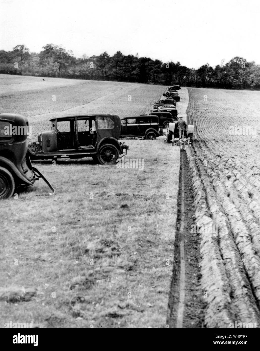 WW2: Old cars block a possible German landing field. Stock Photo