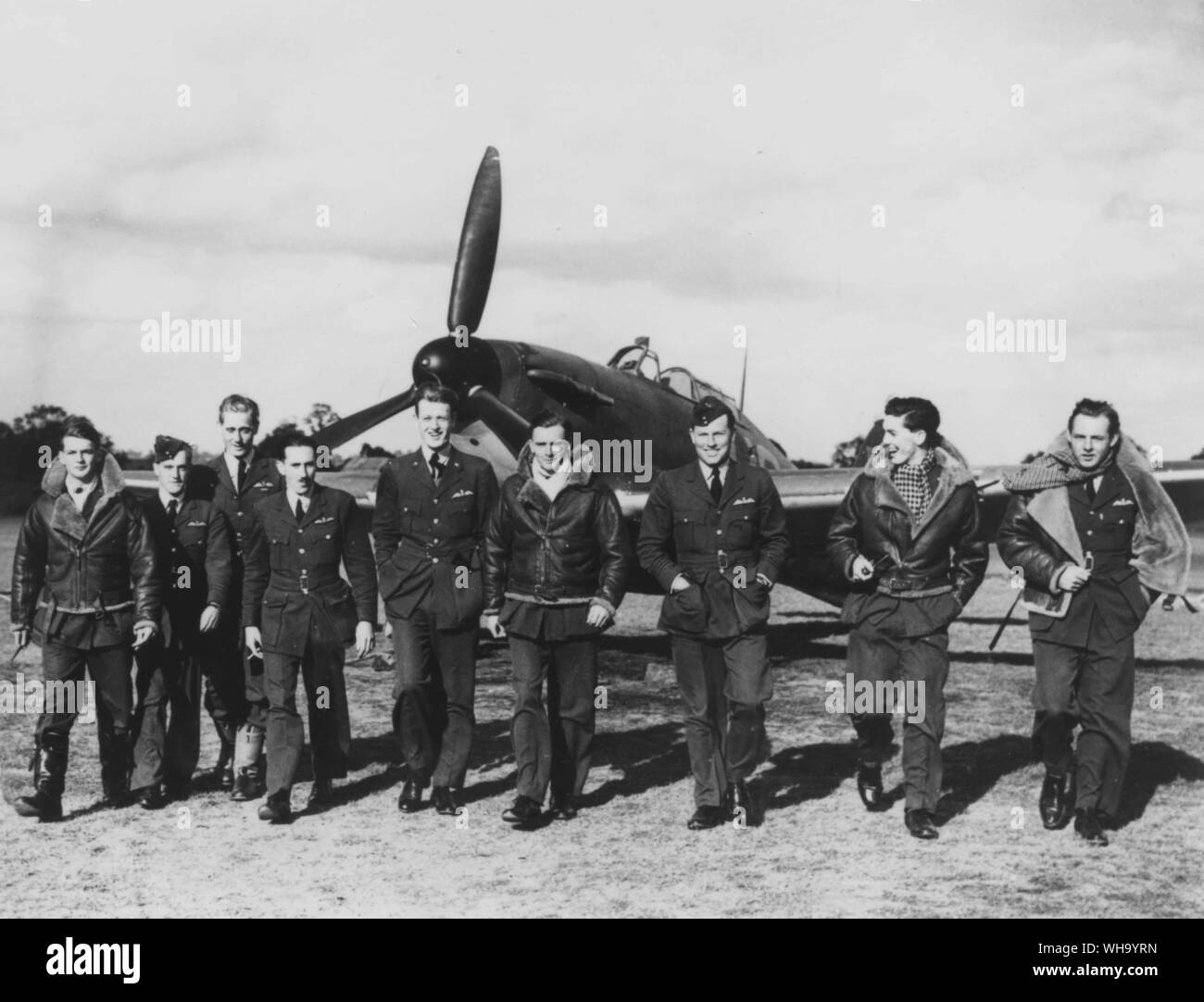WW2: RAF fighter pilots with Spitfire in the background. Stock Photo