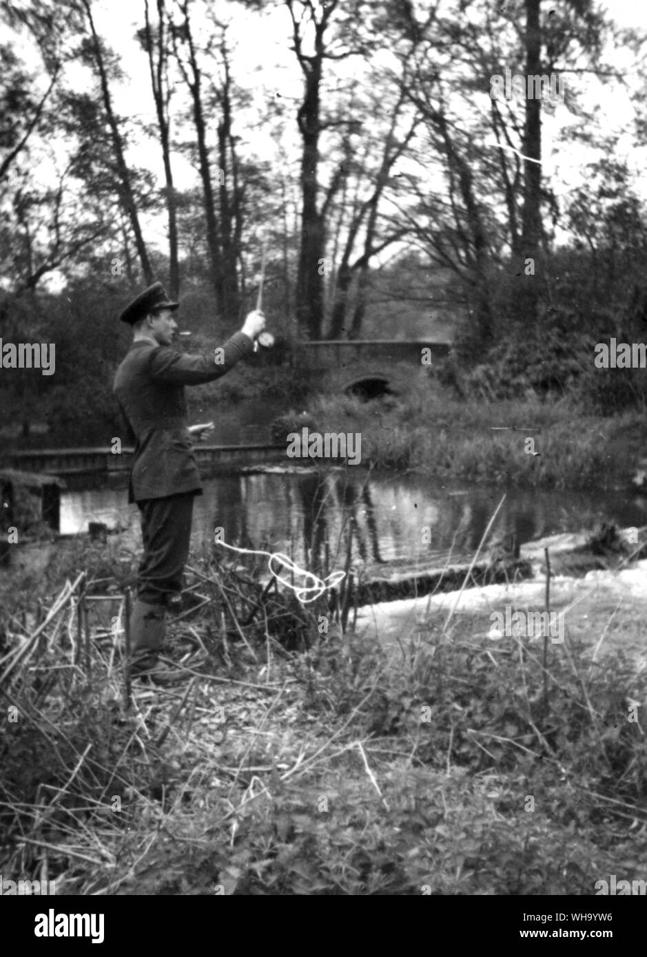 WW2: RAF pilot takes time off to fish. Stock Photo