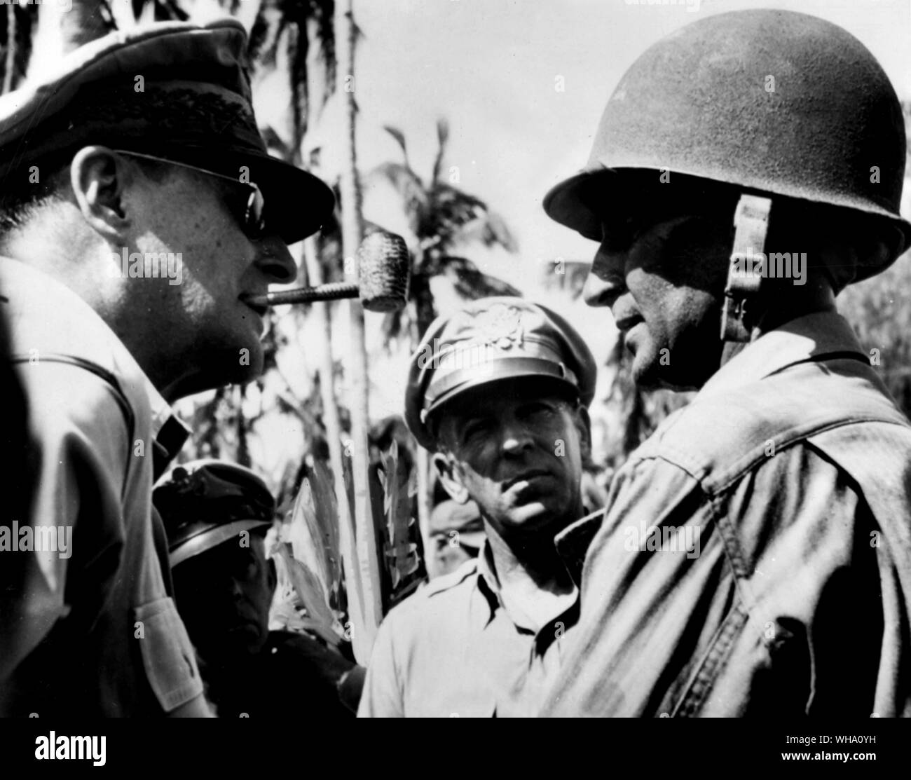 WW2: US General Douglas MacArthur discusses strategy of the Philippine campaign with Major-General Frederick A Irvin (right), commander of the US 24th Division, near Tacloban, liberated capital of Leyte Island. Stock Photo