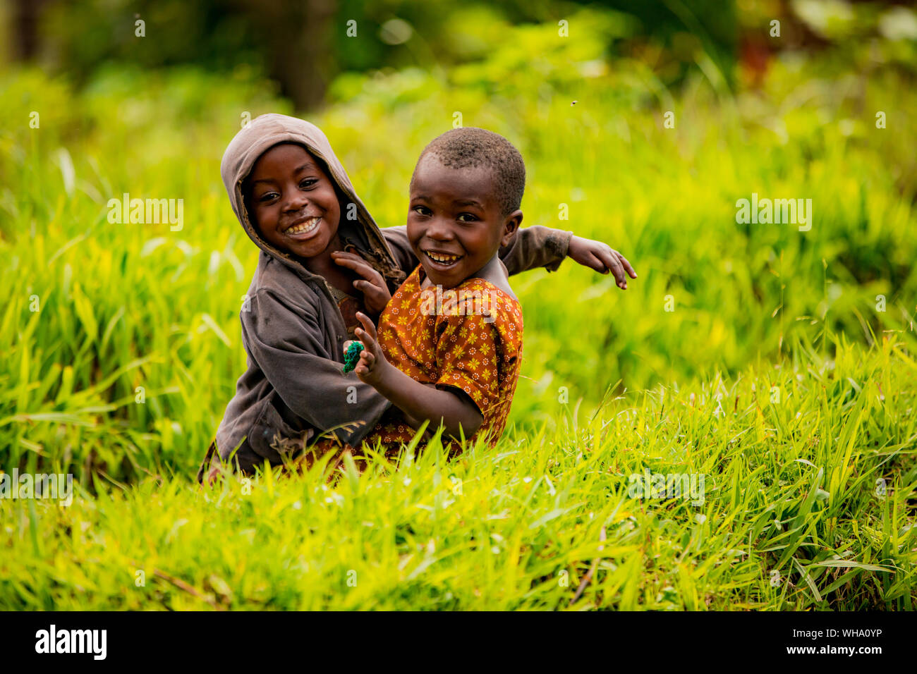 Cute kids posing in Lake Bunyonyi, Uganda, East Africa, Africa Stock Photo