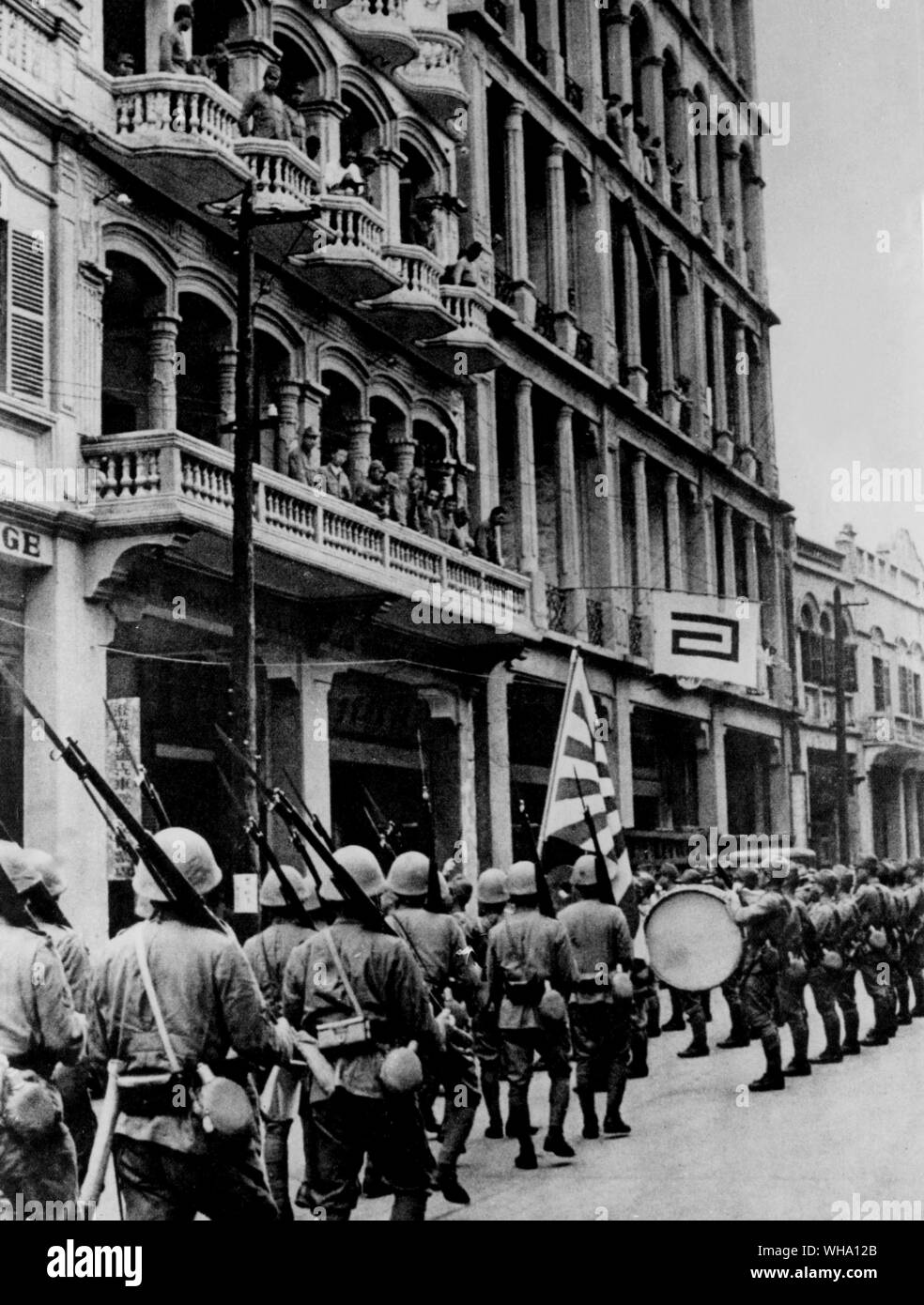 WW2: Japanese marines stage a victory parade along the Bund in Shanghai after seizing control of the city. Stock Photo