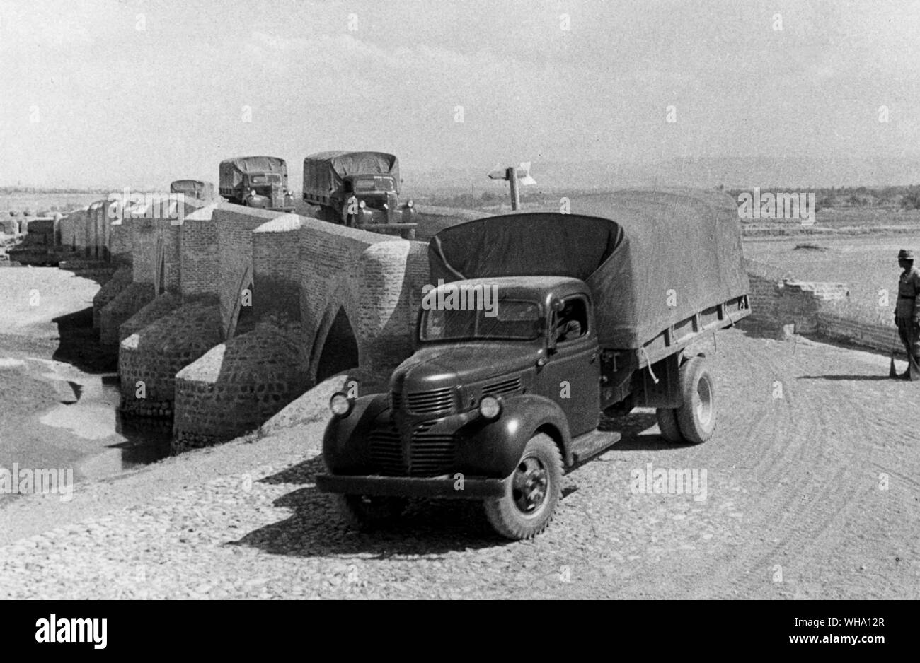 WW2: US lorries going overland in Iran for Russia. Stock Photo
