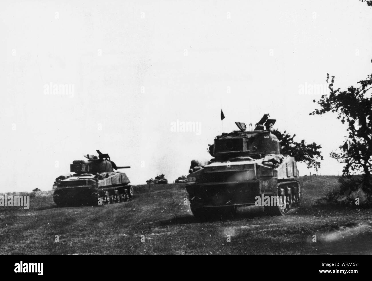 WW2: Tanks roll over the rough terrain. Stock Photo