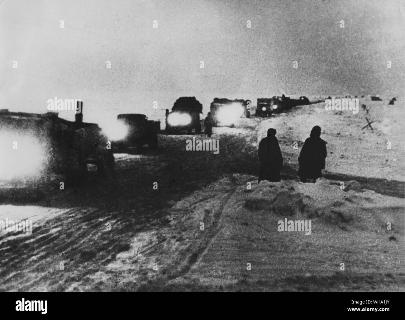 WW2: Leningrad 1942. Lorries travelling by night over the Ladoga route. Stock Photo