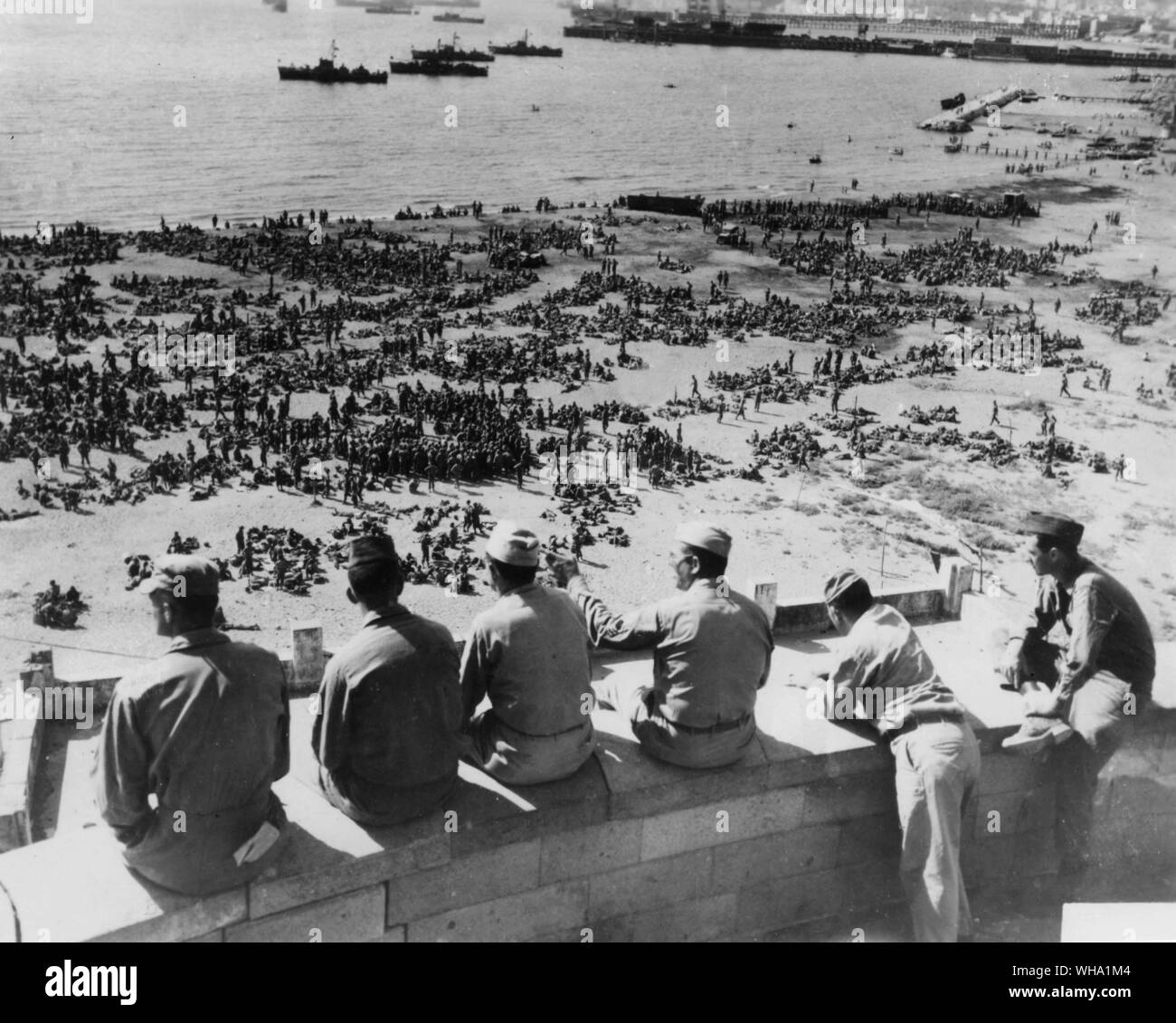 WW2: Invasion loading. Thousands of infantrymen of the 3rd Division on an Italian beach waiting to board landing craft for the invasion of Southern France. August 10th 1944. Stock Photo