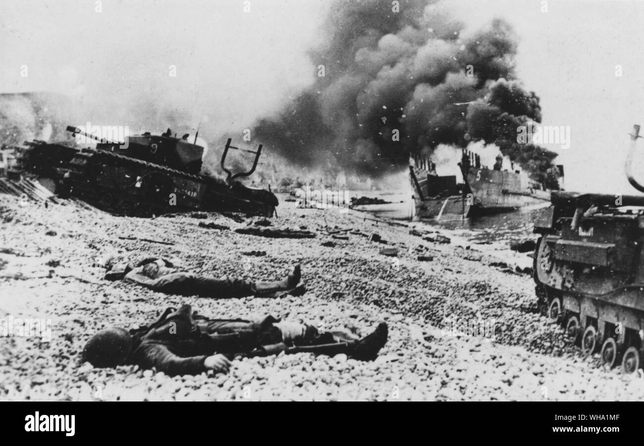 WW2: After the raid on Dieppe, tanks and landing craft on the beach with the bodies of dead soldiers. 19th August 1942. Stock Photo