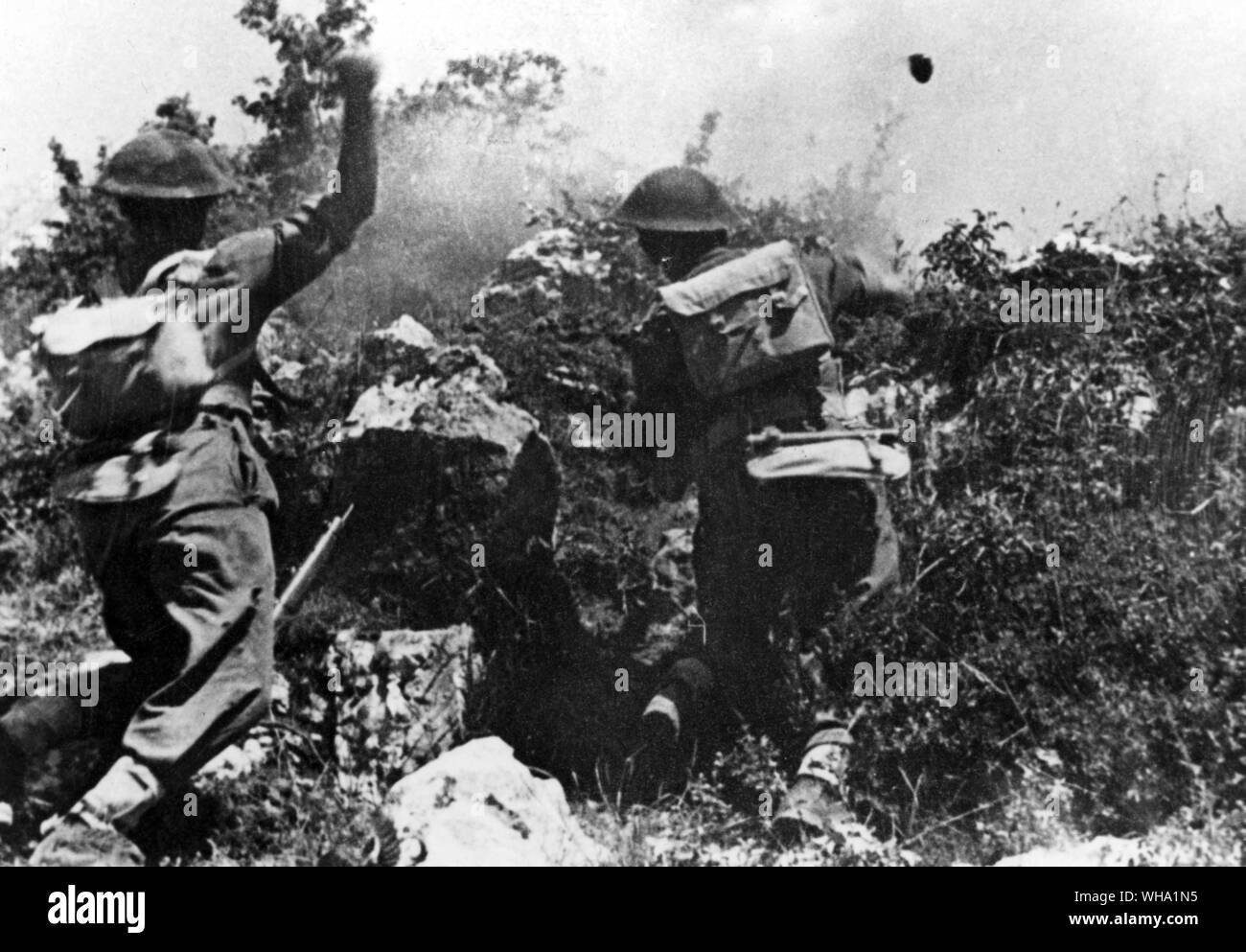 WW2: Polish troops in action on Monte Cassino area. Throwing bombs, May 1944. Stock Photo