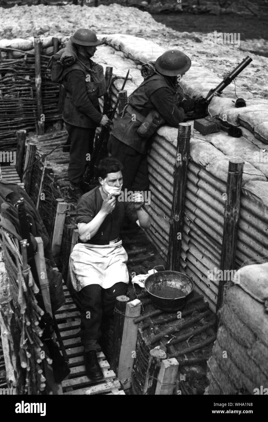 WW2: BEF trenches, France. Allied troops - one of whom is shaving. 1939, or early 1940. Stock Photo