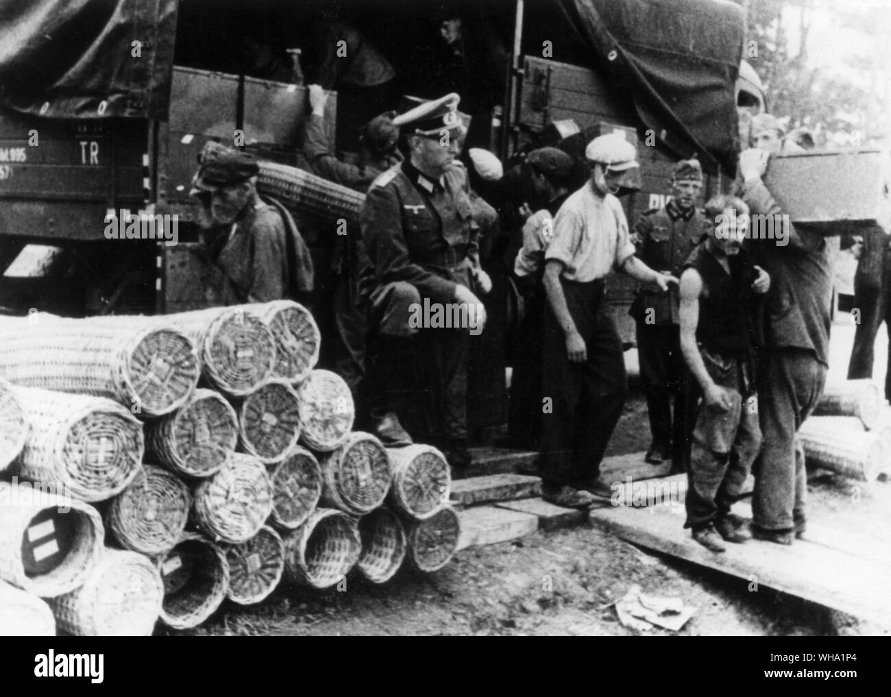 WW2: Jews performing forced labour in Poland, July 1941. In the presence of German officers. Stock Photo