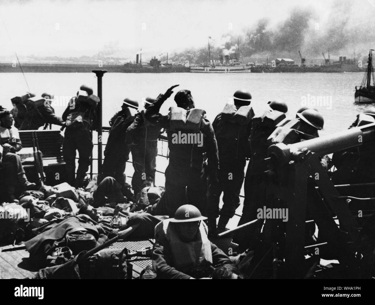 WW2: Dunkirk. Allied troops on transport evacuating them from France, take a look back at the French coast. 22 June 1940. Stock Photo