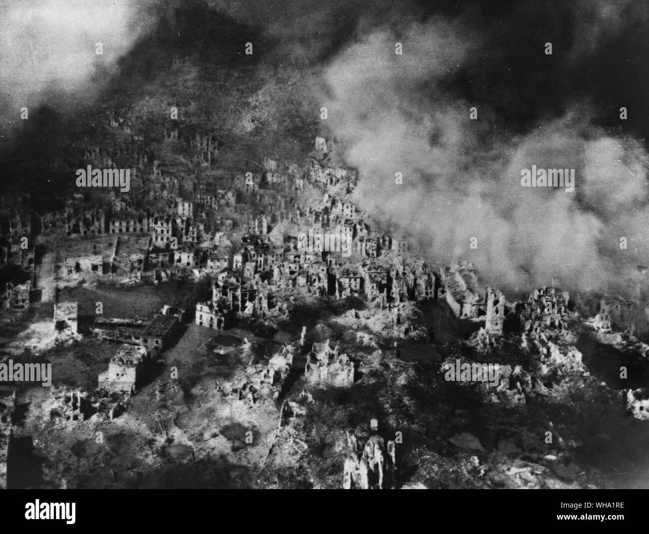 WW2: Skeleton buildings covered with pall of smoke: Cassino. Stock Photo