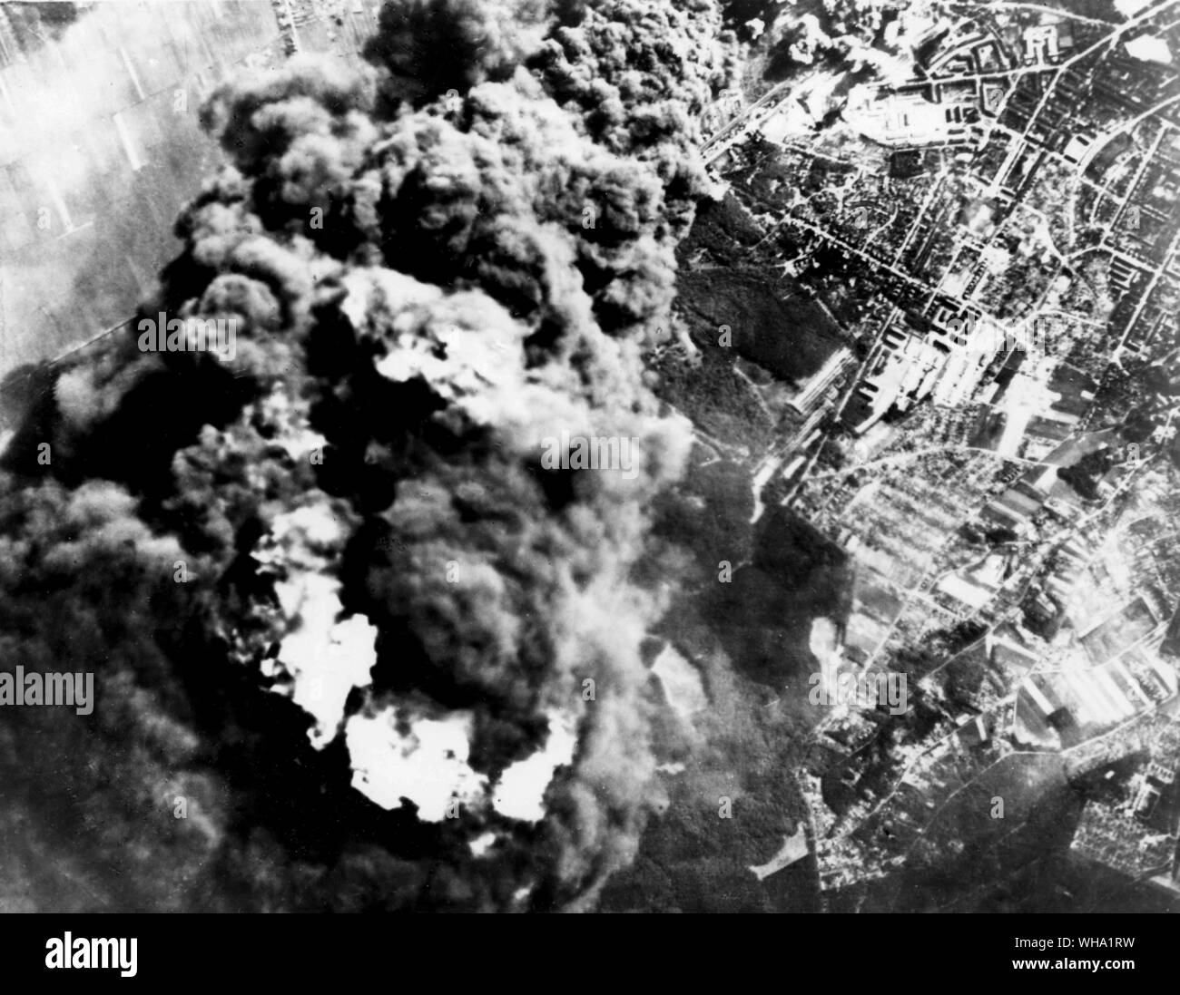 WW2: 8th USAAF heavy bombers attacked oil refineries at Hamburg on 20th June 1944. Leaving 8 plants burning. Here the Rhenania Ossag refinery spouts black smoke thousands of feet into the air furing the assault. Stock Photo