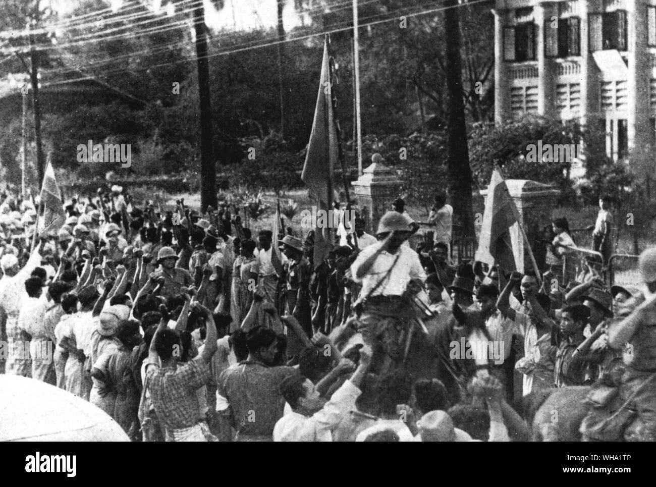 WW2: Japanese enter Tavoy, cheered by Burmese. 11th December 1941. Stock Photo