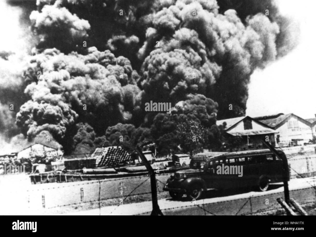 WW2: Dutch East Indies, 1942. Burning buildings. Stock Photo