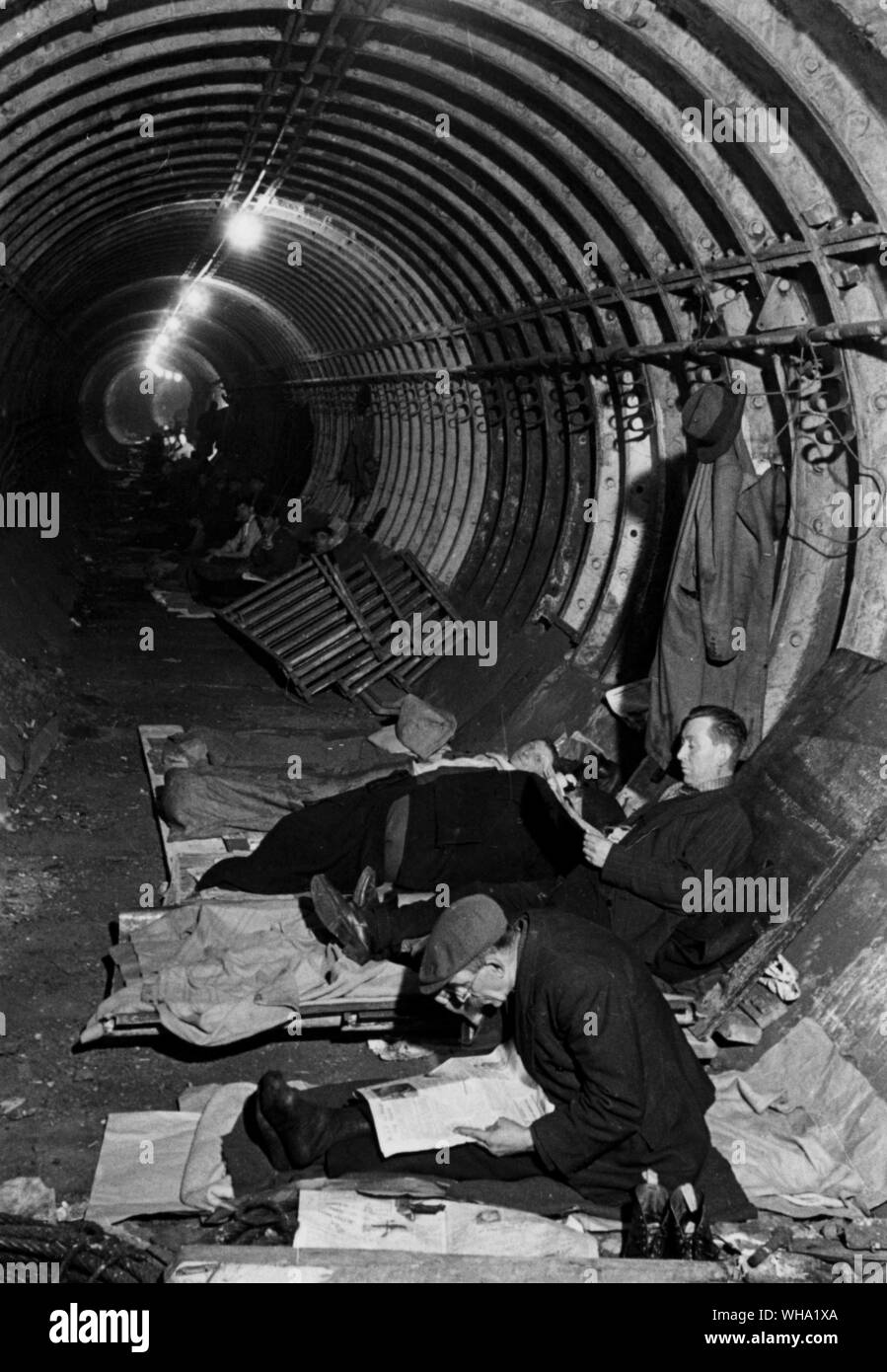 WW2: Sleeping in the Underground, before bunks were installed. Stock Photo