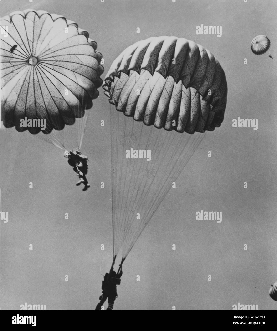 WW2: Nylon was taken off the civilian market in 1942, and went into war to make parachutes. Almost 39,000,000 yeards of nylon yarn went in to 3,860,000 24 foot pack chutes. Stock Photo