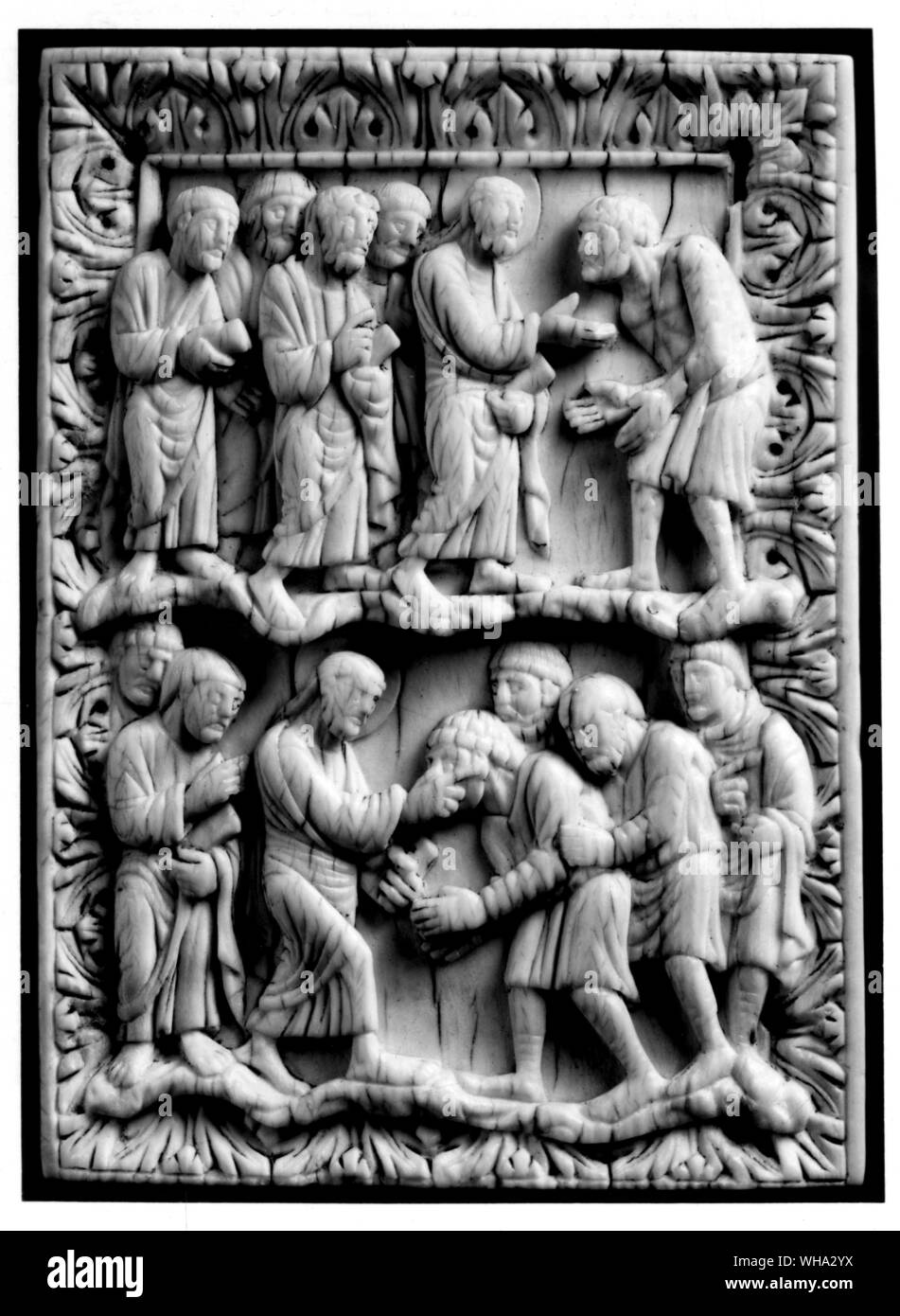 Christ healing the leper and below Christ the blind. In ivory. Stock Photo