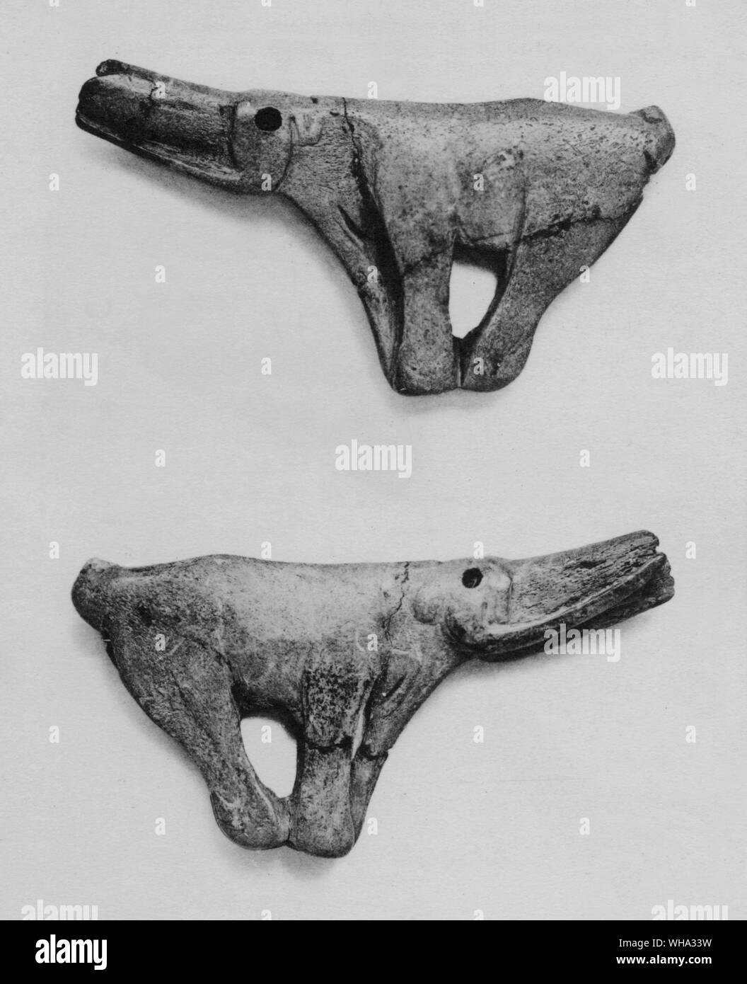 Early man: Carving. Top: dagger handle of reindeer antler, carved in form of a mammoth; Monastruc, Bruniquel, S. France; La Madeleine period. Stock Photo