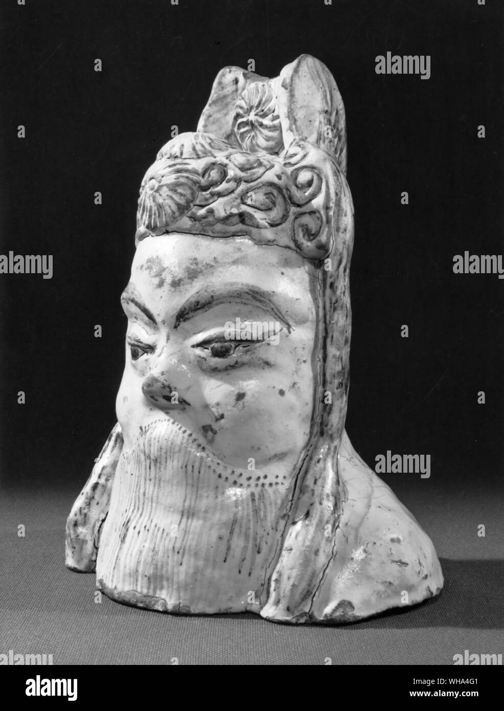 Tz'u chou type bust of an Emperor . probably 18th century . Tz'U CHoU is in the province of Chihli, though it was formerly in Honan. The character which denotes the township is the same as that used for crockery, and Crockery Town is a fitting name; for ware is still manufactured there and it has been a pottery centre since the Sui dynasty. In fact there is no place in China which has had a longer and more continuous connection with ceramics.. . Stock Photo