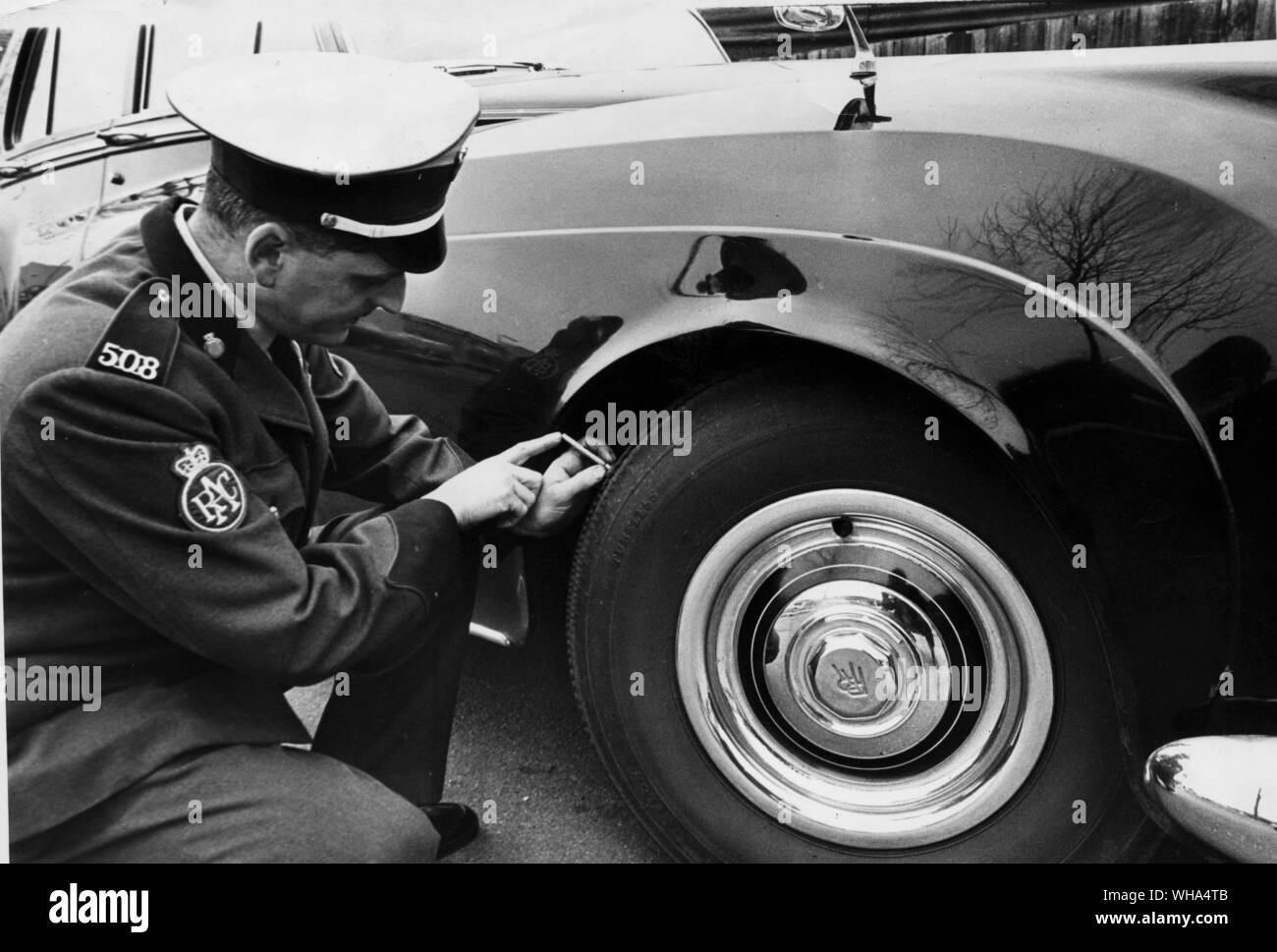 A member of the RAC doing a tyre test before the new laws on tyres comes into force April 1st 1968 Stock Photo