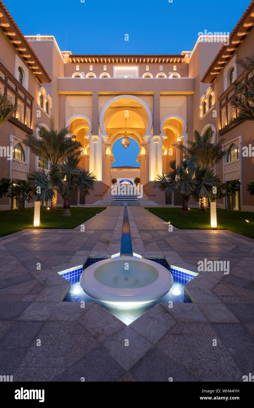 Water feature and architecture at night of luxury hotel, Saadiyat island, Abu Dhabi, United Arab Emirates, Middle East Stock Photo