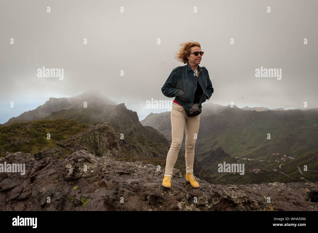 Mature woman standing mountain hi-res stock photography and images - Alamy
