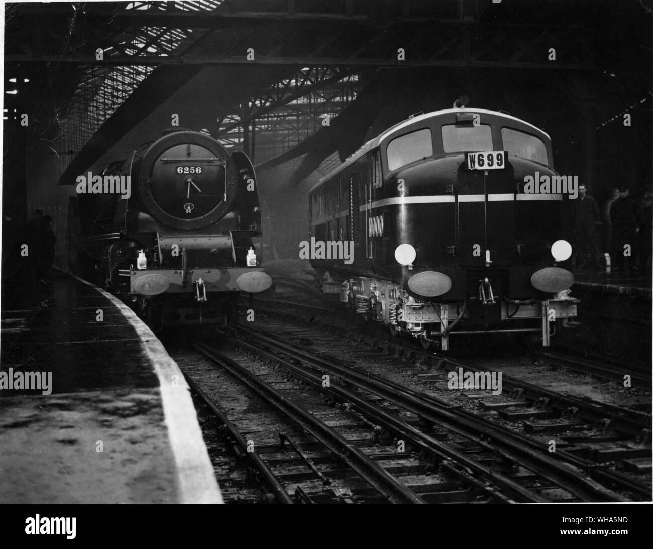 The Diesel Electric Locomotive ( DMS Railway ) pulling out of Euston Station. Also in the picture is one of the latest type of LMS Locomotive. 18th December 1947 Stock Photo