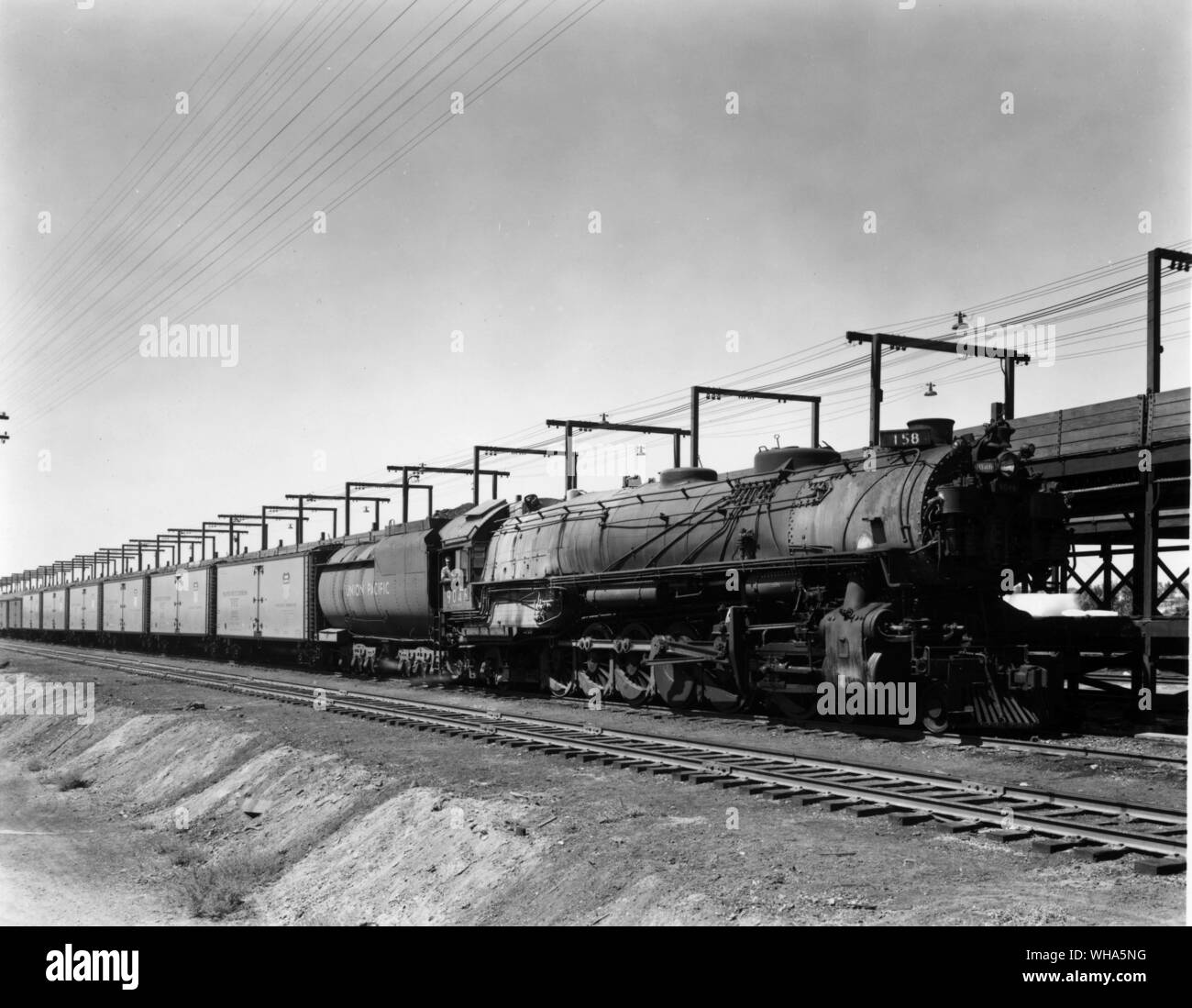 Union Pacific. Pacific Class Steam Locomotive. 4-12-2 wheel arrangement UP Class designation. First of type built in 1926 for freight service. With string of new PFE cars at Nampa, idaho Icing Dock Stock Photo