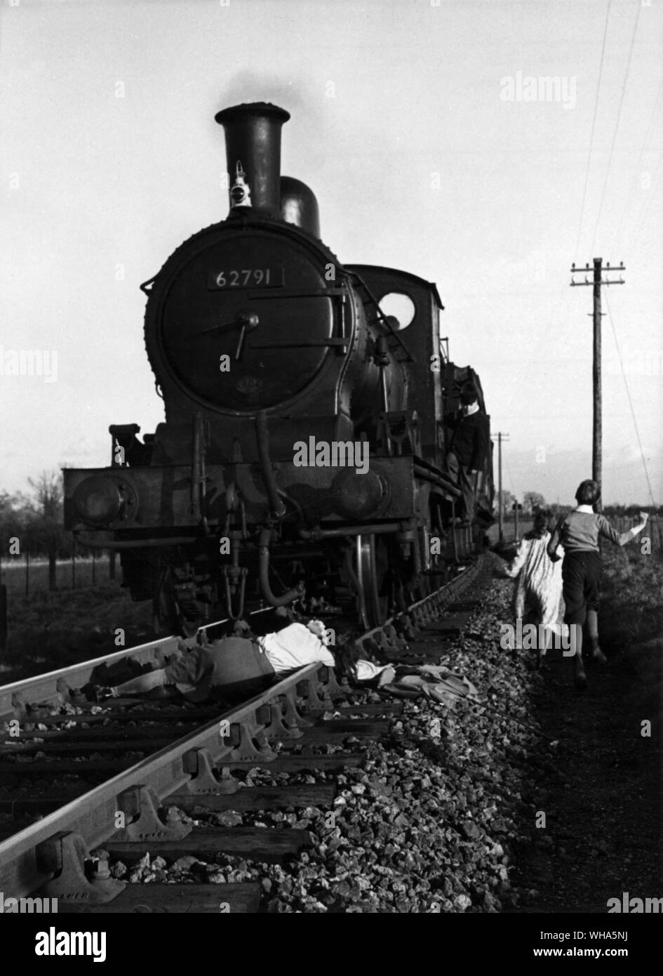 The train from TV Serial The Railway Children. Girl lying on the track Stock Photo