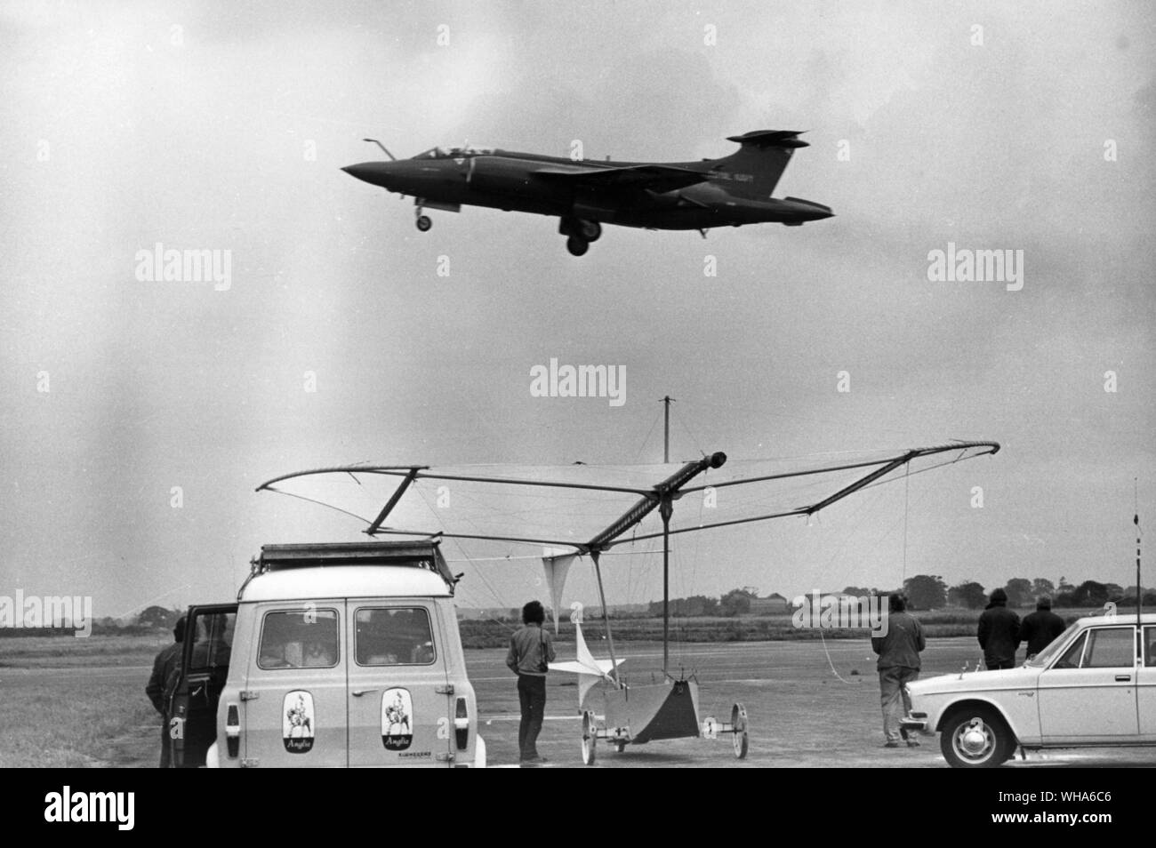 Anglia TV presents a Magnificent Man and his Flying Machine. The old and the new..... A Buccaneer Jet thunders over the Cayley Glider. . Stock Photo