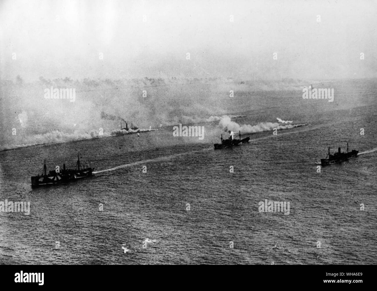 British TB destroyers making a smoke screen protecting a convoy Stock Photo